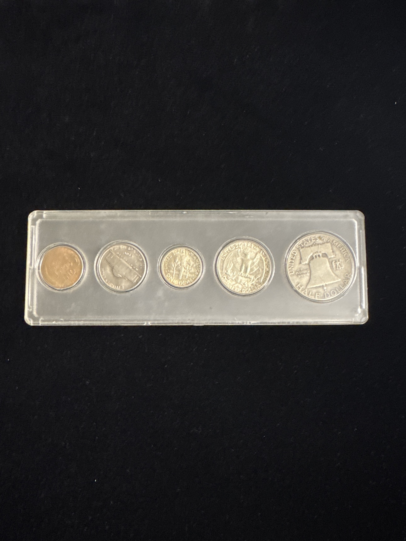 Reverse view of the complete 1953 U.S. proof set in a protective hard plastic holder