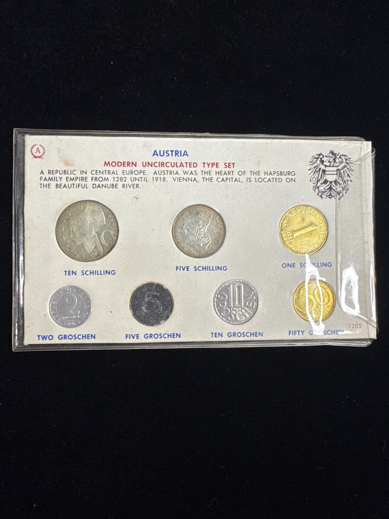 Front of the sealed Austria Modern Uncirculated Type Set display card showing all seven coins